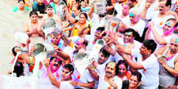 Devotees from Multan in Pakistan and other parts of the country offer milk to the Ganga on the occasion of the Multan Joth Mahotsava in Haridwar on Sunday.