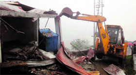 An illegally constructed building being demolished by the Landour Cantt Board at Lakshmanpuri in Mussoorie on Sunday.