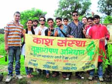 Members of Kaash, a voluntary organisation, during a plantation drive in Dehradun on Sunday.