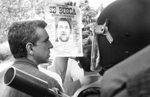 A taxi driver holds a poster with an image of Spain's Prime Minister Mariano Rajoy during a protest in Madrid recently