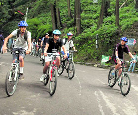 Participants take part in the monsoon cycle rally in Shimla on Sunday.