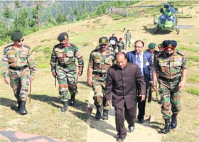 Defence Minister A K Antony with senior Army officers after landing in Kupwara near the LoC on Sunday