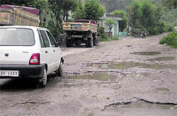 Potholes dot the Talwara-Shiar Bawa road in the Jammu region