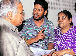 Suspended staff nurse Harjit Kaur Oberoi submits her plea to Health Minister Madan Mohan Mittal in Jalandhar on Sunday