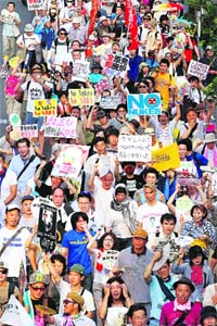 Anti-nuclear protesters chant slogans during a demonstration in Tokyo on Sunday