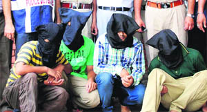 Four members of the gang in the police custody in Amritsar on Monday.