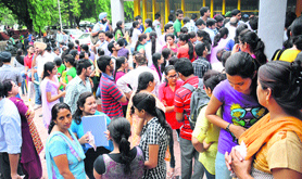 Students wait for counselling outside the Law Auditorium at Panjab University on Monday.