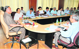 Chief Minister Vijay Bahuguna chairs a review meeting of the Forest Department in Dehradun on Monday.