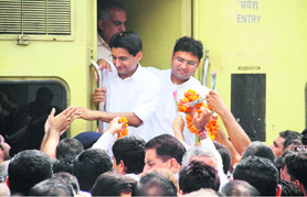 Rohtak MP Deepender Singh Hooda and Sirsa MP Ashok Tanwar alight from the Shatabdi Express at Tohana.