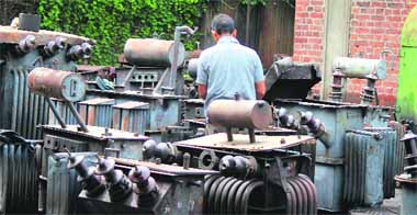 A worker repairs a transformer at a PDD workshop in Jammu. 