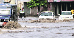 Commuters had a tough time crossing the Jalandhar-Kapurthala road near Basti Bawa Khel that got clogged up with water after just a moderate spell of rain.