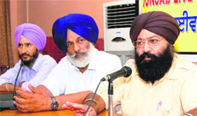 Members of the Punjab Dairy Association announce the hike in milk prices during a press conference in Jalandhar on Monday.