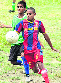 A footbal match being played between Senior Secondary School, Hazara, and Senior Secondary School, Bundala, during the three-day Jalandhar District Games orgnaised by the District Tournament Commitee in Jalandhar on Monday.