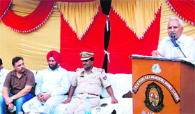 Police officials and members of the Azad Youth Welfare Society during a police-public meet at Kishanpura in Jalandhar on Sunday.