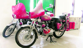 Motorcycles with fire extinguishers at the Deputy Commissioners office in Ludhiana on Monday.