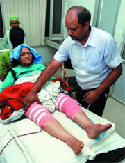 Dr Ajay Gupta checks on Tarlochan Kaur after she underwent a surgery during which both her knees were replaced at Civil Hospital in Bathinda.