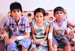 The children, who were bitten by a dog, wait to meet Mayor Raj Bala Malik in Chandigarh on Tuesday. 