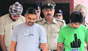 The accused in police custody in Chandigarh on Tuesday.