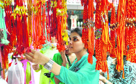 A girl selects a rakhi ahead of Raksha Bandhan in Jammu on Tuesday.