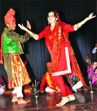 Artistes perform during the cultural function in Government Women College, Gandhi Nagar, in Jammu on Tuesday.