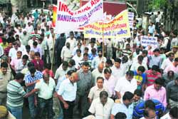 Industrialists hold a rally against power crisis in Panipat on Tuesday.