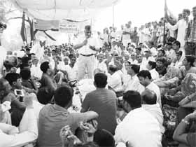Former Army Chief General VK Singh addresses farmers in Gorakhpur, Fatehabad, on Tuesday.