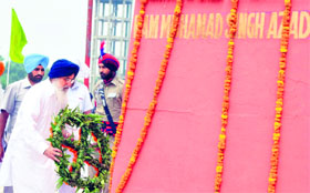 Chief Minister Parkash Singh Badal lays a wreath at the memorial of Shaheed Udham Singh in Sunam on Tuesday.