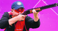 USAs Vincent Hancock competes in the Shooting Skeet men qualification at the Royal Artillery Barracks in London on Tuesday.  AFP