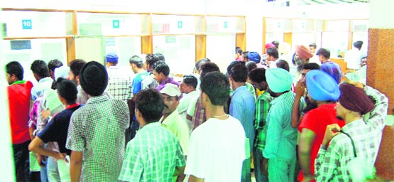 Visitors throng the suvidha kendra in the Deputy Commissioner office in Amritsar on Wednesday. photo: sameer sehgal 