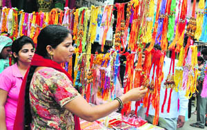 A woman takes her pick at a Rakhi shop in Karnal.