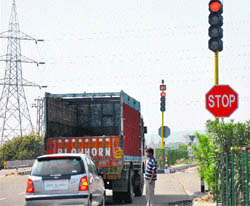 A traffic light being put to the test at an intersection in Jammu. The authorities have decided to make the signals functional from August 3 in a bid to streamline traffic.