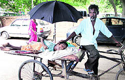 Shambhu with his son Sonu at the Civil Hospital in Jalandhar