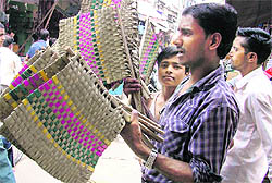 A man sells hand fans in Ludhiana