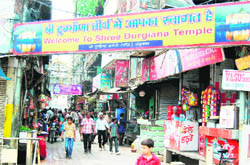 Shops to be razed; and (right) the site where trees were axed to make way for the commercial complex inside the Durgiana Temple complex in Amritsar.