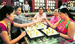 Women buy jewellery at a shop in Chandigarh