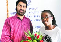 Balwant Thakur, regional director, ICCR, felicitates Tshivolo Tshandyemwene Renatte of Namibia in Jammu. A Tribune photograph