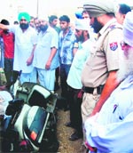 Policemen conduct investigation at the accident site at Bhagtanwala in Amritsar on Friday. Photo: Sameer Sehgal 