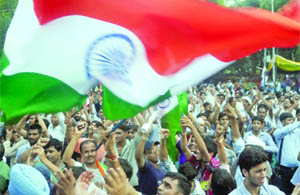 Supporters gather at Jantar Mantar as Anna Hazare and his associates break fast on Friday.