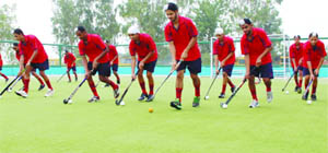 Players of Baba Uttam Singh National Hockey Academy practise at the academy ground in Khadur Sahib. 