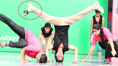 A torn shoe (in circle) fails to dampen the spirits of a student of Lovely Professional University, who continued to perform rare feats at a freshers party on the campus near Jalandhar on Friday. 