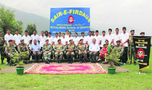 The touring students and their teachers pose with the GOC, CIF ( Delta), Maj Gen MR Babu and soldiers of 23 Rastriya Rifles.