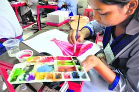A student takes part in a talent-hunt competition at Sportking Institute of Fashion Technology.