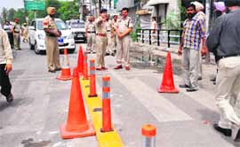ACP Swapan Sharma shows the newly fixed central verge to Commissioner of Police Ishwar Singh in Ludhiana on Friday. 