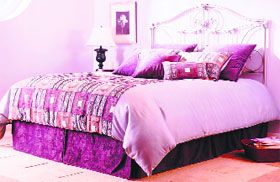 Colour coordination with a generous sprinkling of pillows and cushions usher in style and harmony in this clutter-free modernistic decor