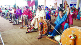 Inmates of the Pingalwara Charitable Society spin cotton on charkhas.