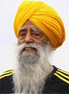 The video in question allegedly shows Fauja Singh (above) wiping his face with his beard while another shows Faujas cartoon being overrun by a speeding truck. 