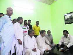 Congress ticket aspirants and their supporters with party observer Shailender Mohan Singla at Kangra on Saturday.