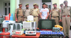 Police officials with the acused and recovered goods at Bhatindi police post in Jammu on Saturday. Tribune photo: Inderjeet Singh