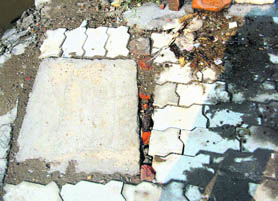 The dislocated tiles on a road in Jagraon.