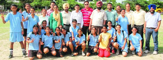 Players of PAU zone strike a pose after winning the football final in Ludhiana on Saturday. 
